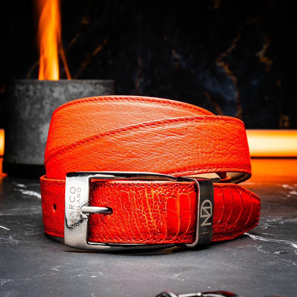 Close-up of the Alessio Belt Orange by Marco Di Milano, a handcrafted luxury accessory made from genuine orange ostrich leather, highlighting its distinctive texture and five adjustment holes against a white background.