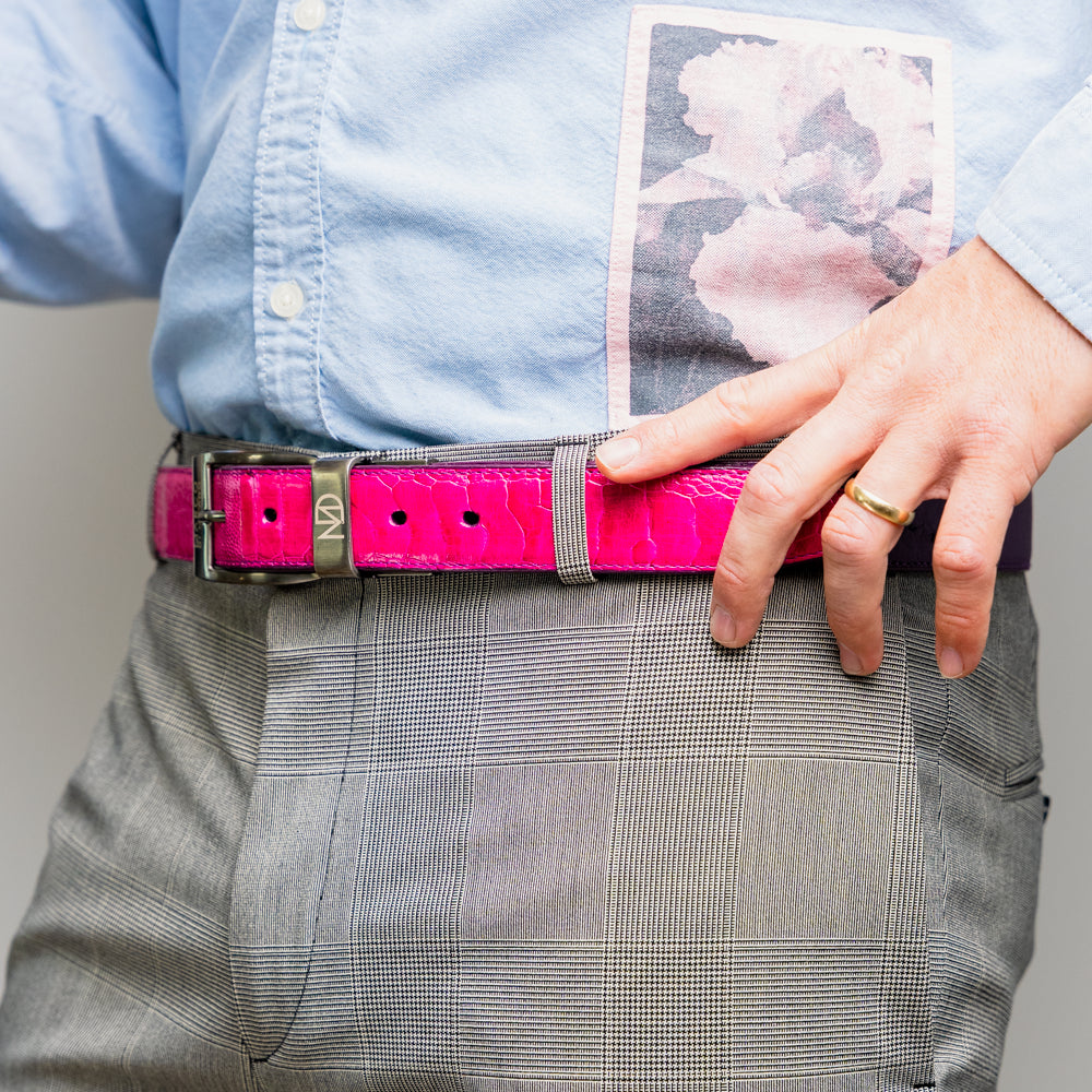Introducing the Marco Di Milano Alessio Belt in Pink/Purple—a luxurious handcrafted accessory featuring a purple top side and a finely textured bright pink inner side, completed with a meticulously finished silver buckle engraved with the Marco Di Milano logo.