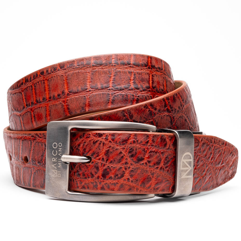 A rolled-up, textured rustic cognac leather Emilio Belt by Marco Di Milano with a silver rectangular buckle engraved with the brand name.