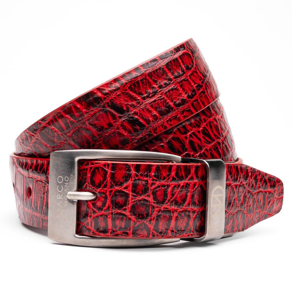 The Emilio Belt Antique Red by Marco Di Milano is a rolled-up red crocodile-patterned leather belt with hand-painted finishes and a silver buckle, displayed on a white background.