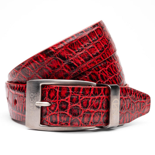 The Emilio Belt Antique Red by Marco Di Milano is a rolled-up red crocodile-patterned leather belt with hand-painted finishes and a silver buckle, displayed on a white background.