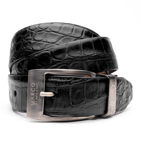 The Emilio Belt Black by Marco Di Milano features coiled black leather with a crocodile texture and a silver buckle engraved "MARCO DI MILANO," pairing perfectly with the brand’s luxury footwear for a refined look.