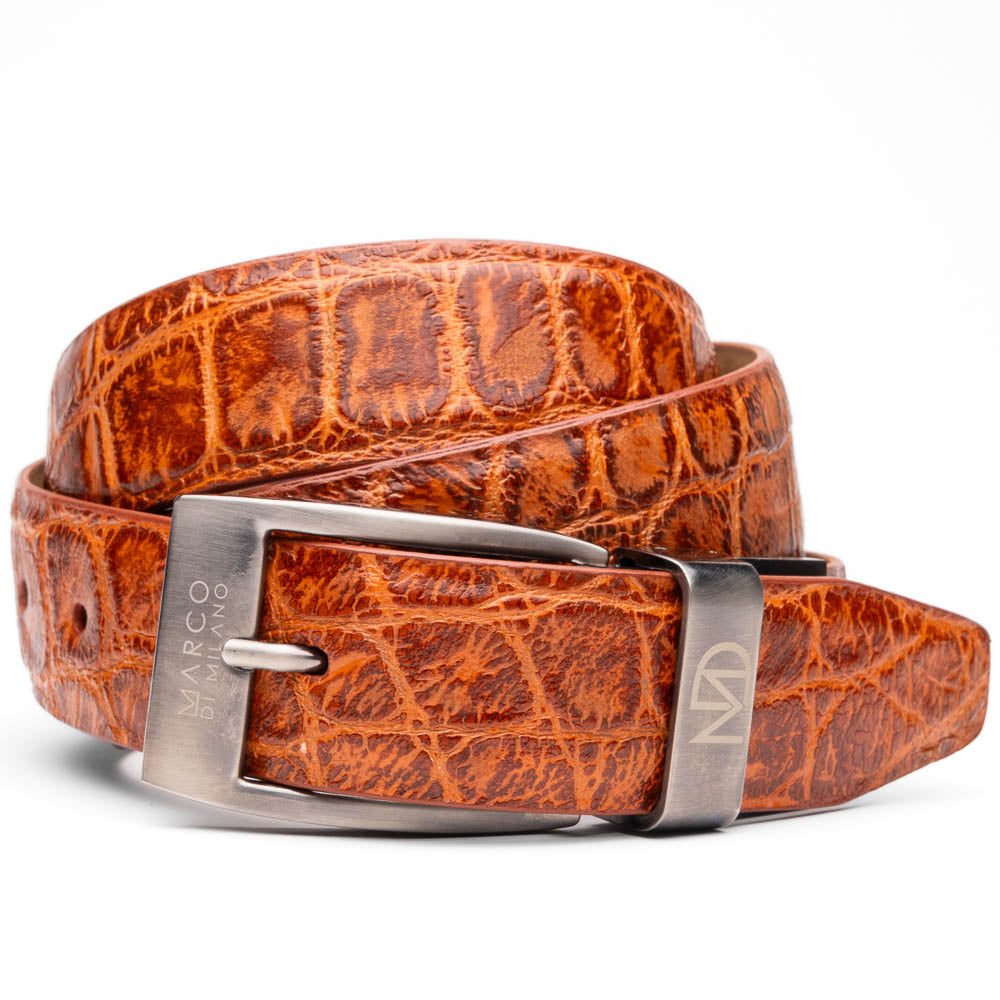 The Emilio Belt Antique Honey by Marco Di Milano features a textured crocodile-pattern finish and a branded metal buckle—an elegant accessory that pairs perfectly with luxury footwear or genuine alligator belts.