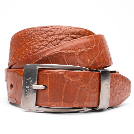 The Emilio Belt Cognac by Marco Di Milano features textured cognac leather and a silver buckle engraved with the brand name, shown on a white background—a refined accessory that complements Marco Di Milano’s luxury footwear.