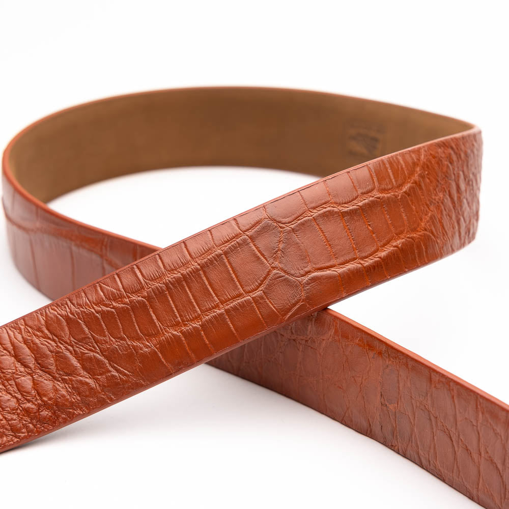 The Emilio Belt Cognac by Marco Di Milano features textured cognac leather and a silver buckle engraved with the brand name, shown on a white background—a refined accessory that complements Marco Di Milano’s luxury footwear.