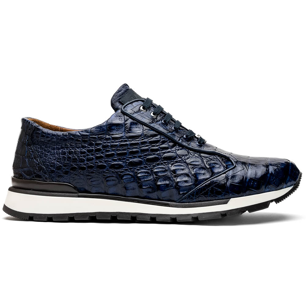 The Alonzo Navy by Marco Di Milano is a luxury men's sneaker in genuine caiman crocodile leather, featuring black laces, a hand-painted finish, white midsole, and black textured outsole.