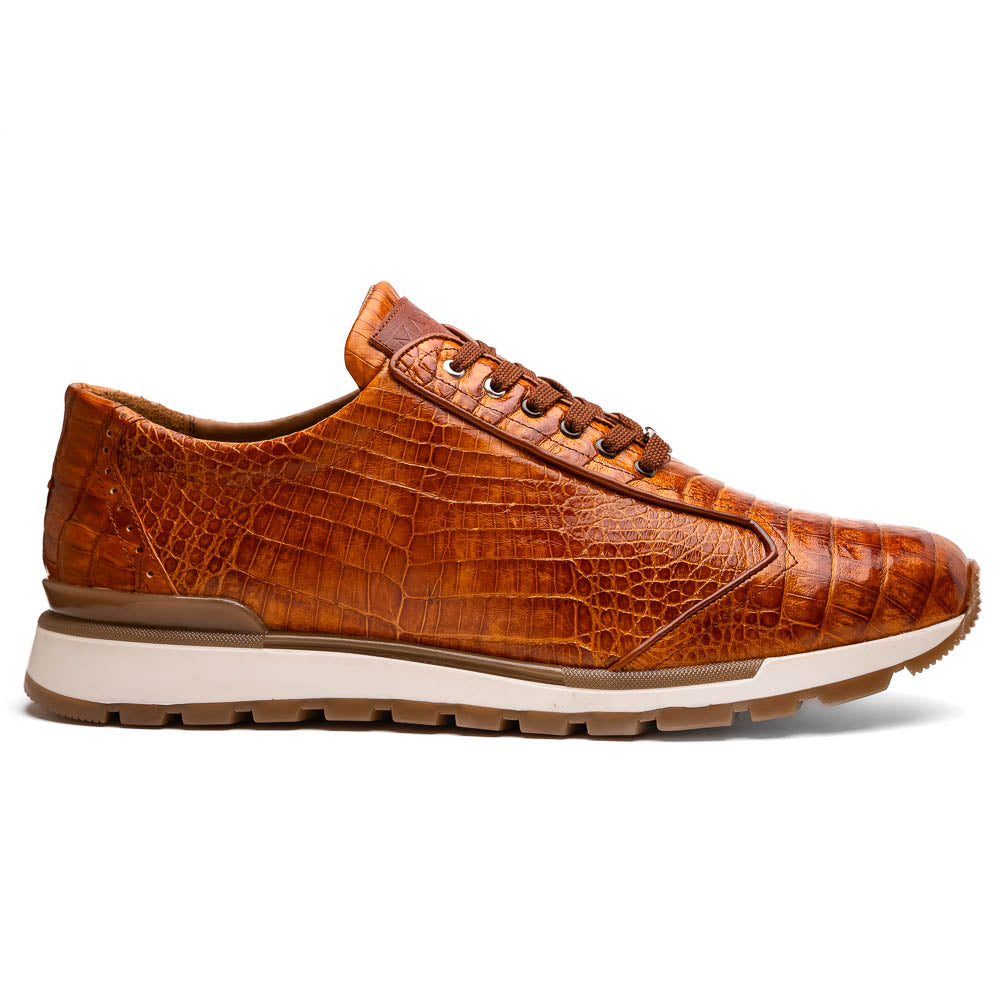 The Alonzo Cognac sneaker by Marco Di Milano features a hand-painted brown caiman crocodile-patterned leather upper and a white-brown rubber sole—luxury footwear for discerning tastes, shown in a sleek side view.