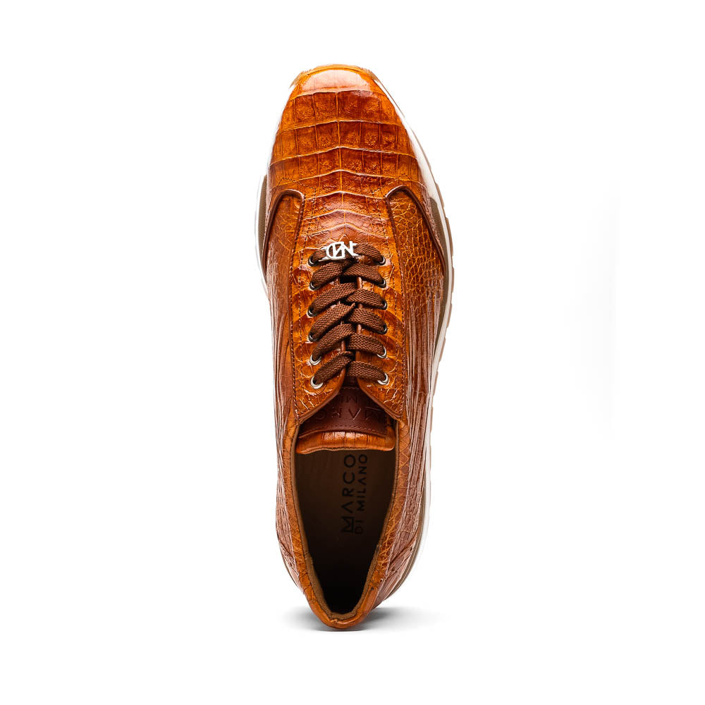 The Alonzo Cognac sneaker by Marco Di Milano features a hand-painted brown caiman crocodile-patterned leather upper and a white-brown rubber sole—luxury footwear for discerning tastes, shown in a sleek side view.