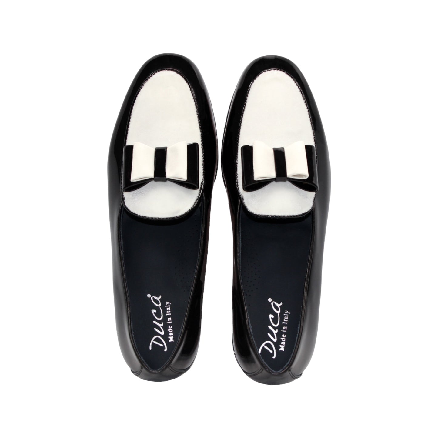 The Duca Di Matiste Amalfi loafer in black and white features a patent leather design, low heel, decorative bow, and Italian craftsmanship. Available in store size 9.5 only (final sale), shown on a plain white background.