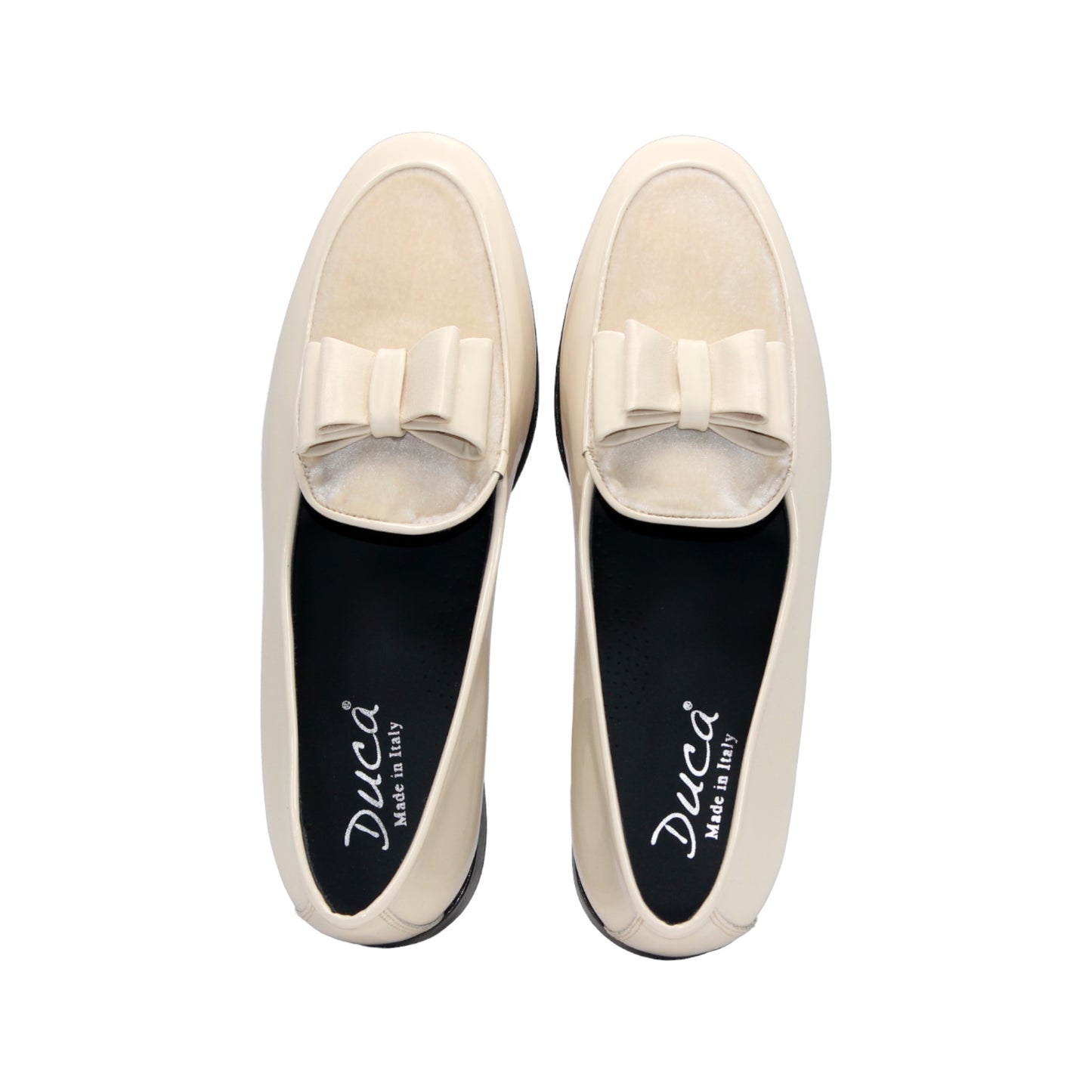 The Duca Di Matiste Duca Amalfi Cream is a cream leather loafer inspired by Amalfi Italian style, featuring a low black heel and a decorative bow detail.