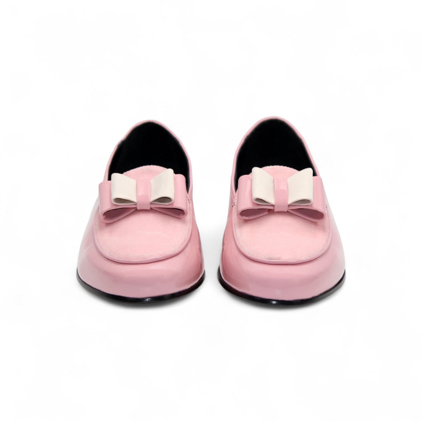 The Duca Amalfi Pink by Duca Di Matiste is a pink patent loafer with a low black heel and a rectangular buckle, inspired by Italian luxury shoes, shown in side view on a white background.