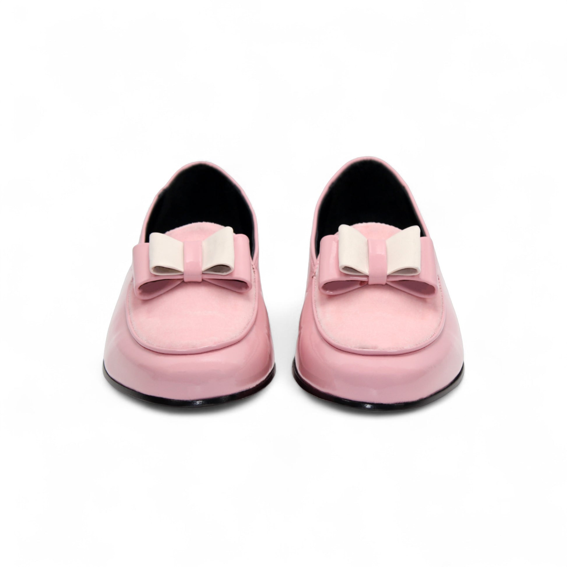 The Duca Amalfi Pink by Duca Di Matiste is a pink patent loafer with a low black heel and a rectangular buckle, inspired by Italian luxury shoes, shown in side view on a white background.