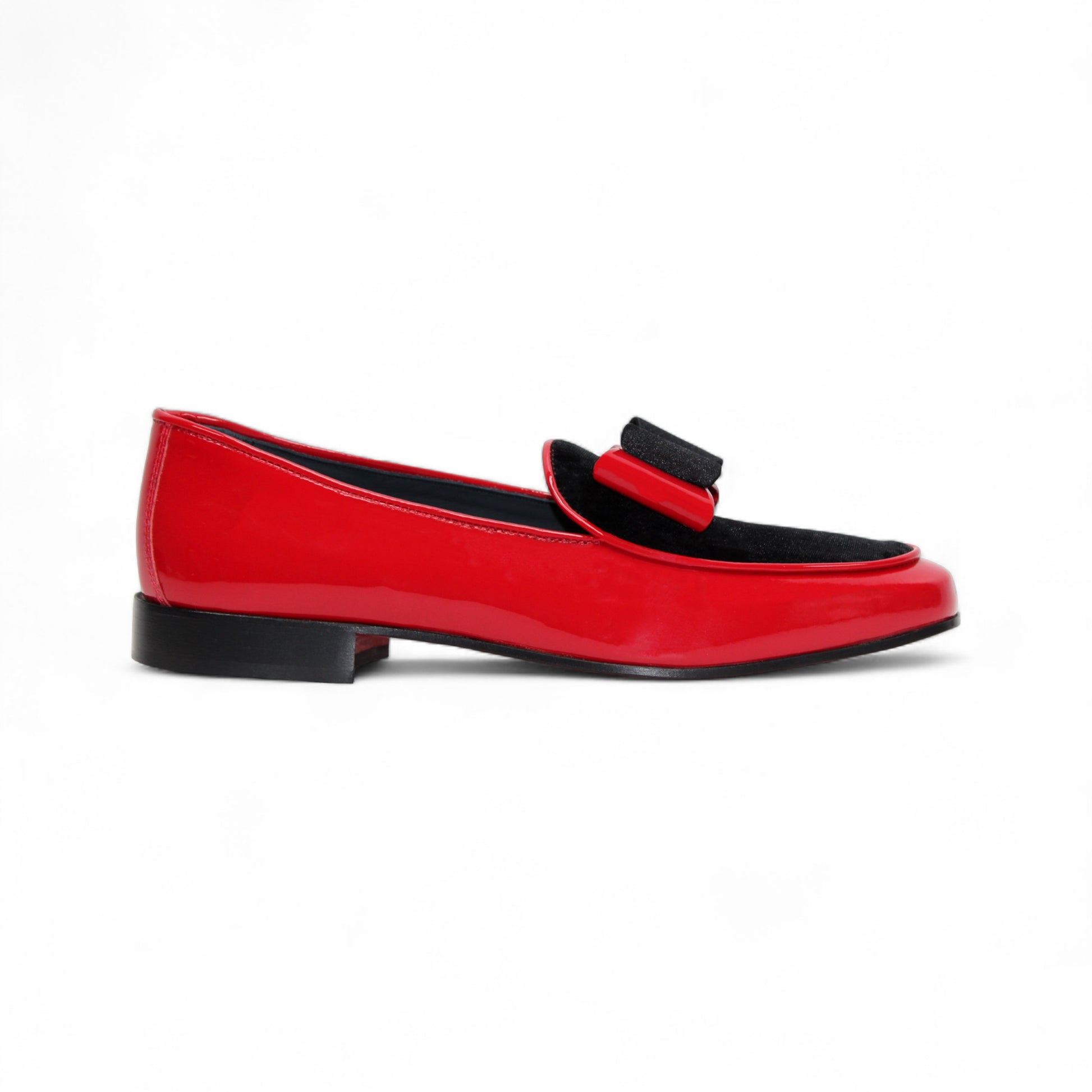 The Duca Red/Black by Duca Di Matiste is a red patent leather shoe with black velvet detail and a black sole, shown in side profile on a white background—an elegant Italian-made design.