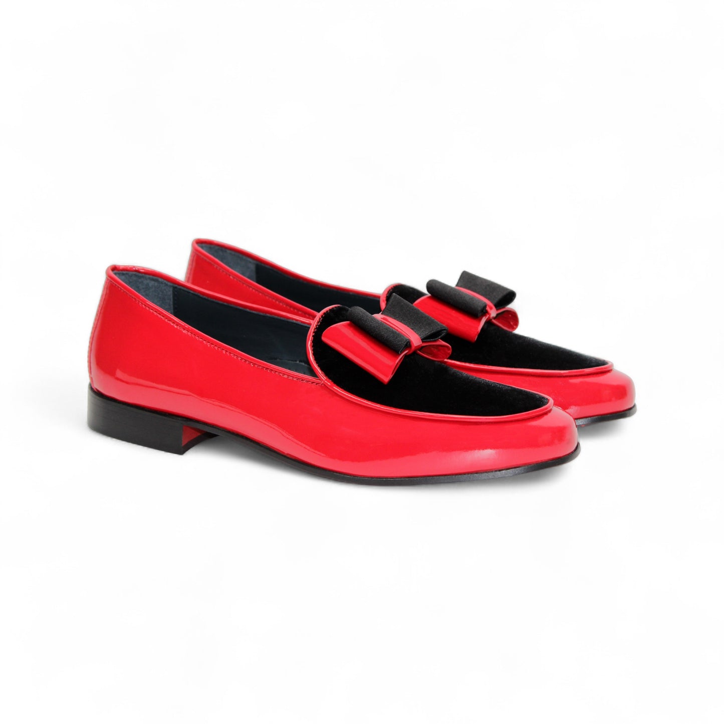 The Duca Red/Black by Duca Di Matiste is a red patent leather shoe with black velvet detail and a black sole, shown in side profile on a white background—an elegant Italian-made design.