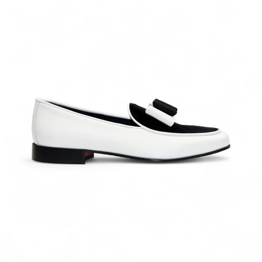The Duca Di Matiste Duca Amalfi White/Black loafer features Italian-made white leather, a black sole, black upper detail, and a black and white bow, shown in side profile on a white background.