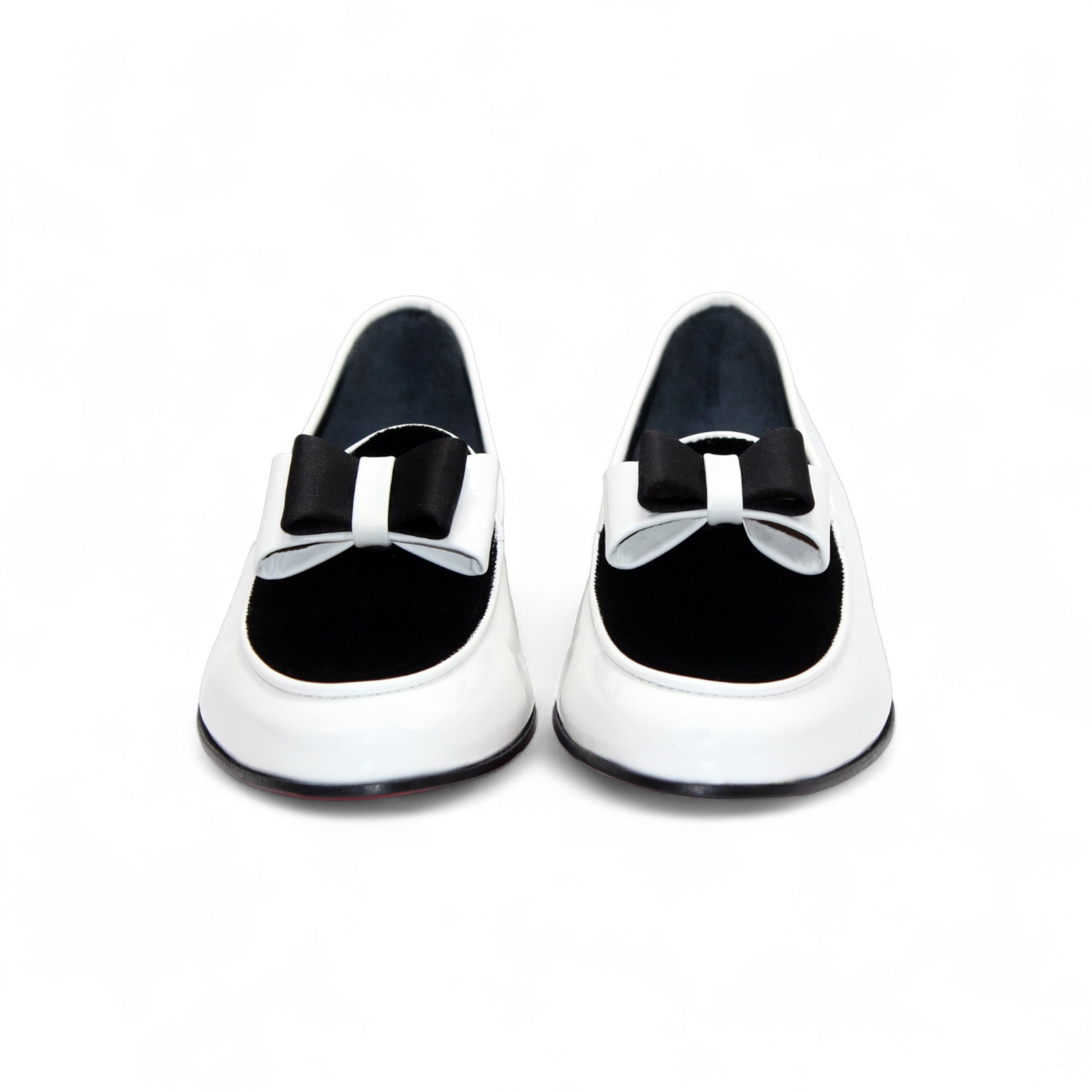 The Duca Di Matiste Duca Amalfi White/Black loafer features Italian-made white leather, a black sole, black upper detail, and a black and white bow, shown in side profile on a white background.