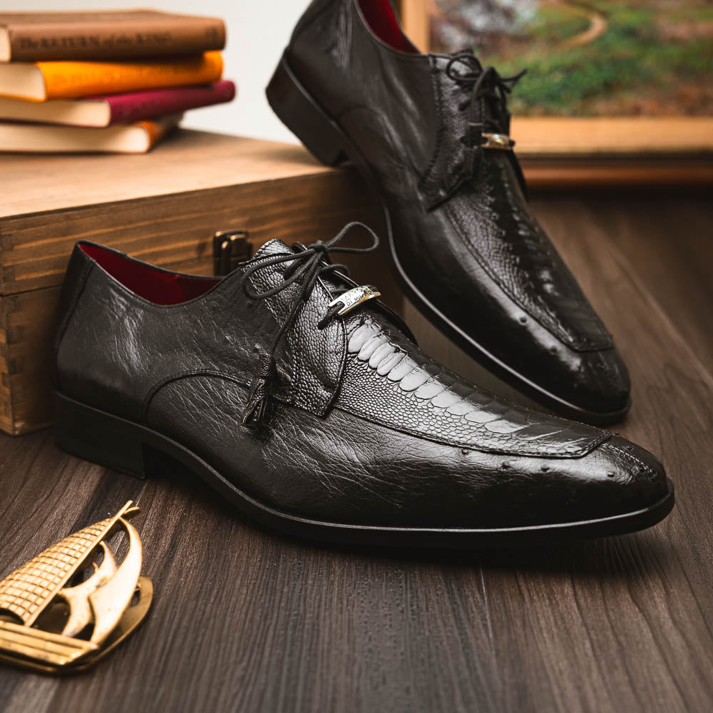 A pair of Andretti Black shoes by Marco Di Milano—one upright to reveal the textured upper, the other on its side showing the brown branded sole—showcasing luxury men's footwear.