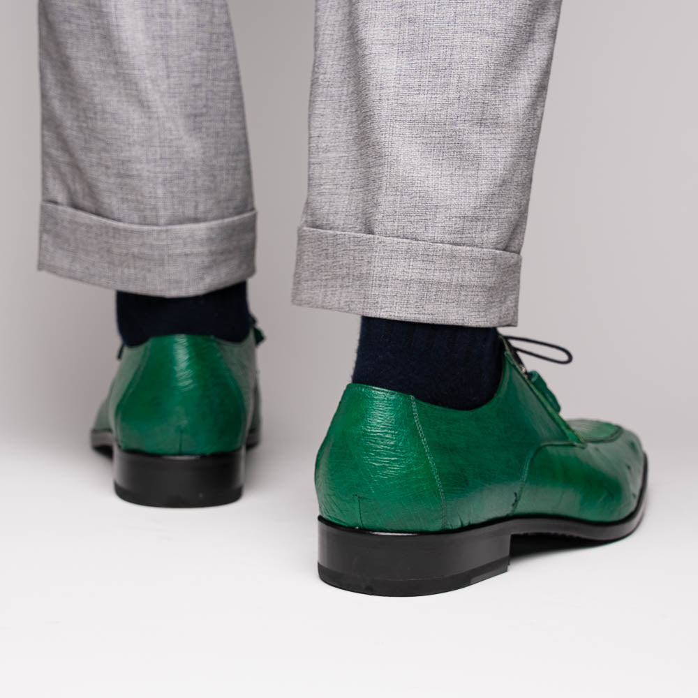A pair of Marco Di Milano Andretti Lemon Green men's shoes, crafted from genuine ostrich leather with a textured pattern, black laces, and red interior lining—one shoe shown on its side to display the sole.