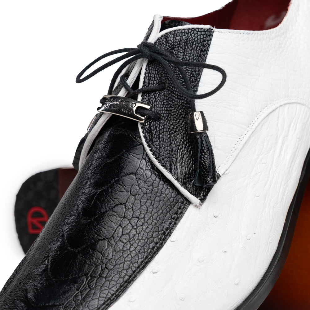 A pair of men’s luxury Andretti Black / White dress derby shoes from Marco Di Milano, these genuine ostrich leather shoes showcase elegant white uppers with black lace-up detailing; one shoe is shown upright while the other displays the rich brown sole.