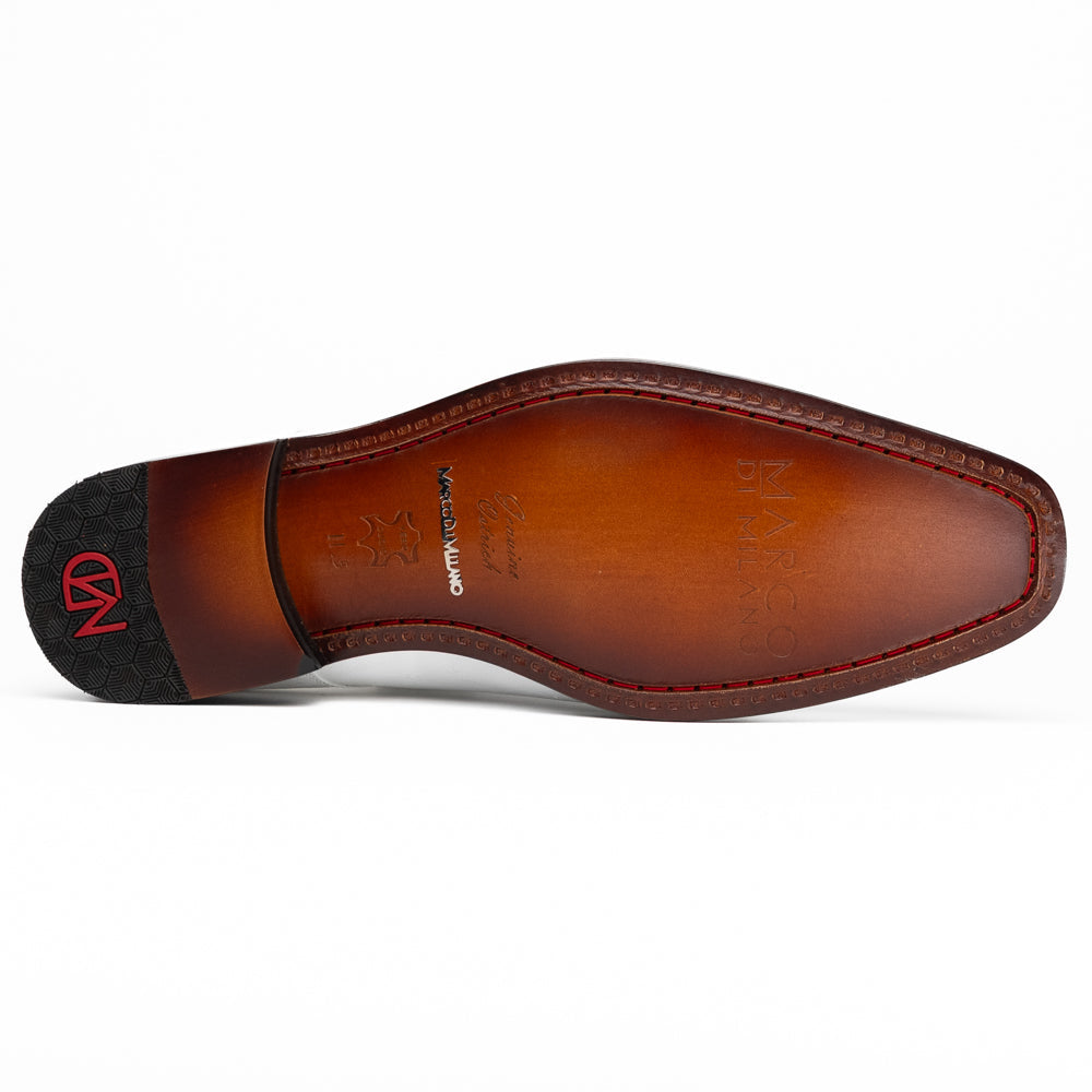A pair of men’s luxury Andretti Black / White dress derby shoes from Marco Di Milano, these genuine ostrich leather shoes showcase elegant white uppers with black lace-up detailing; one shoe is shown upright while the other displays the rich brown sole.
