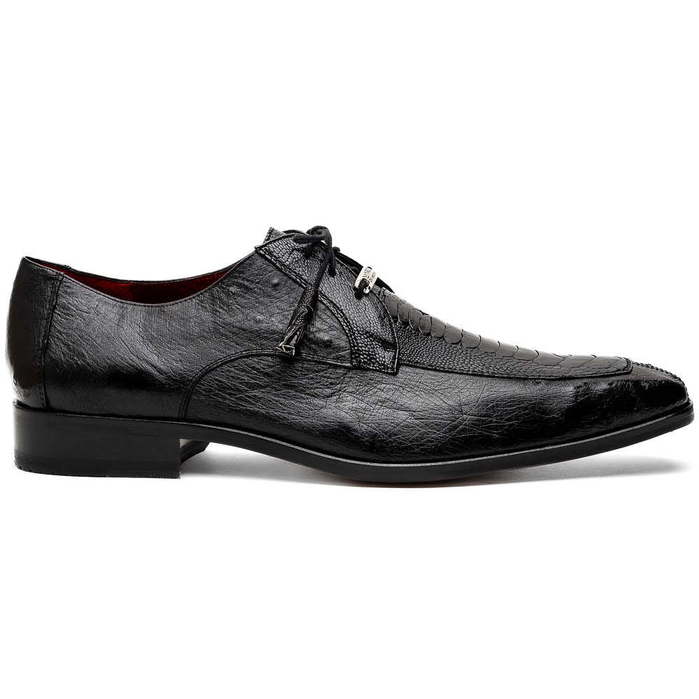 A pair of Andretti Black shoes by Marco Di Milano—one upright to reveal the textured upper, the other on its side showing the brown branded sole—showcasing luxury men's footwear.