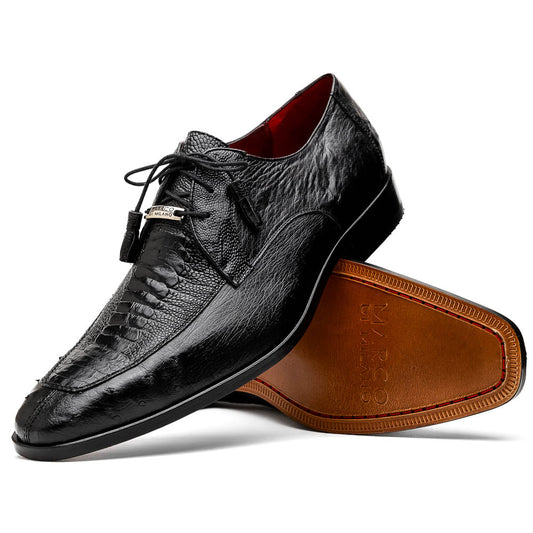 A pair of Andretti Black shoes by Marco Di Milano—one upright to reveal the textured upper, the other on its side showing the brown branded sole—showcasing luxury men's footwear.
