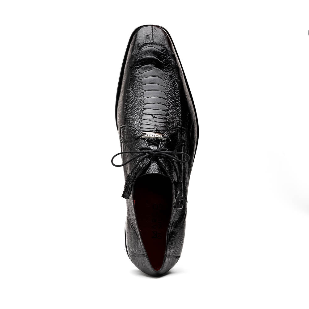 A pair of Andretti Black shoes by Marco Di Milano—one upright to reveal the textured upper, the other on its side showing the brown branded sole—showcasing luxury men's footwear.