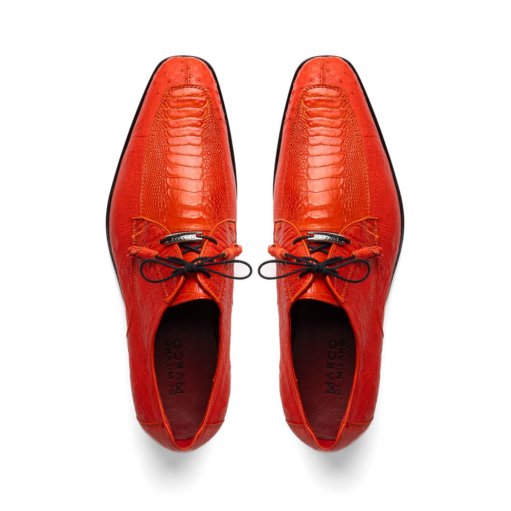 The Andretti Orange by Marco Di Milano are vibrant orange leather dress shoes with black laces and textured detailing, one upright and one showing the branded sole—ideal luxury footwear for men.