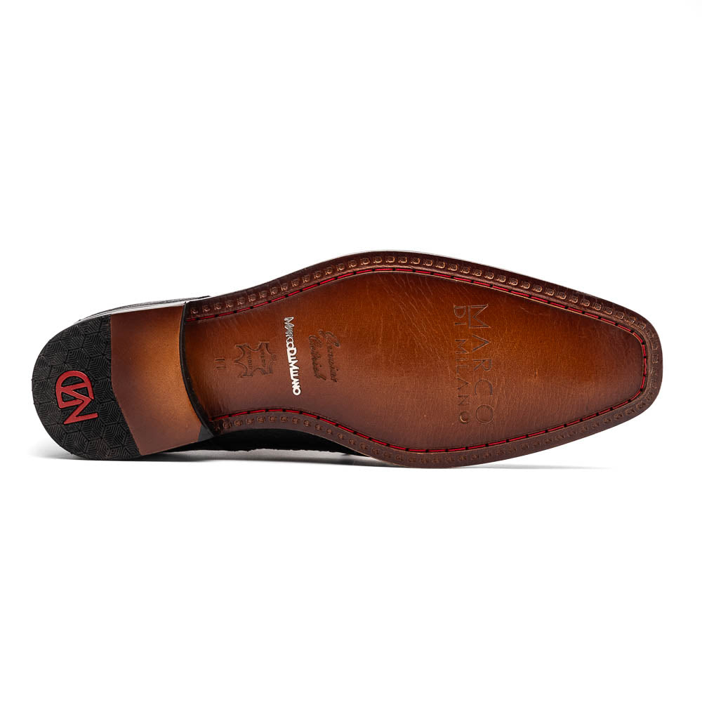 The Andretti White / Black by Marco Di Milano is a black and white leather dress shoe with a textured pattern, black laces, and a brown embossed leather sole—luxury footwear for any occasion.