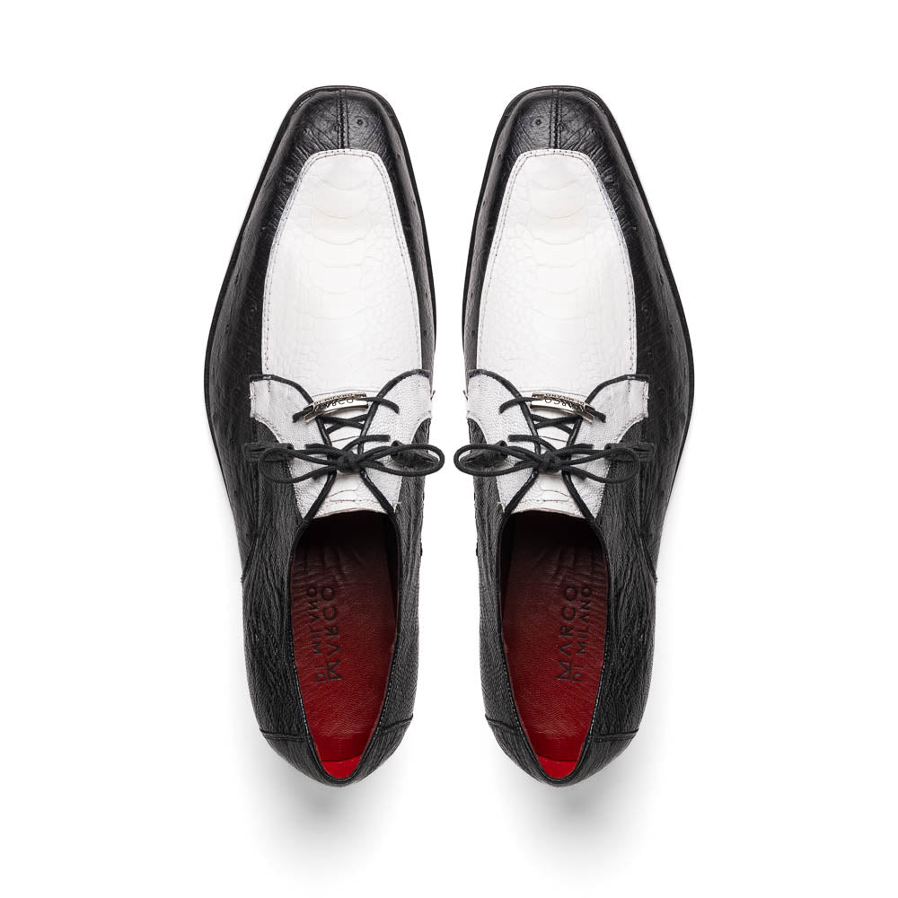 The Andretti White / Black by Marco Di Milano is a black and white leather dress shoe with a textured pattern, black laces, and a brown embossed leather sole—luxury footwear for any occasion.
