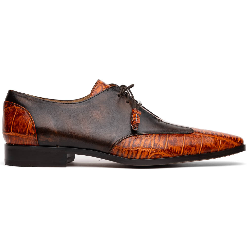 Step out in style with the Marco Di Milano Anzio Rustic Brandy men's leather dress shoes, showcasing a brown and orange crocodile pattern, lace-up closure, and "MARCO" branding—perfect for those who appreciate luxury footwear.