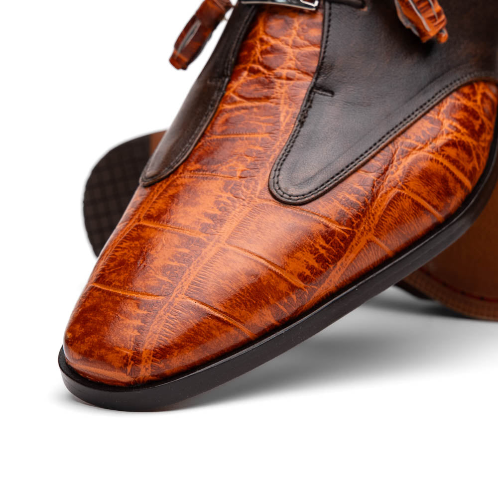 Step out in style with the Marco Di Milano Anzio Rustic Brandy men's leather dress shoes, showcasing a brown and orange crocodile pattern, lace-up closure, and "MARCO" branding—perfect for those who appreciate luxury footwear.