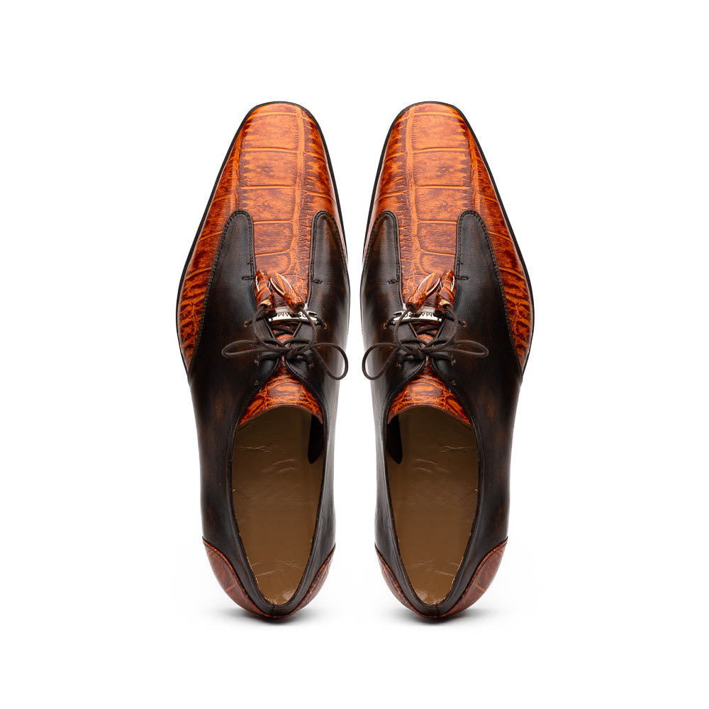 Step out in style with the Marco Di Milano Anzio Rustic Brandy men's leather dress shoes, showcasing a brown and orange crocodile pattern, lace-up closure, and "MARCO" branding—perfect for those who appreciate luxury footwear.