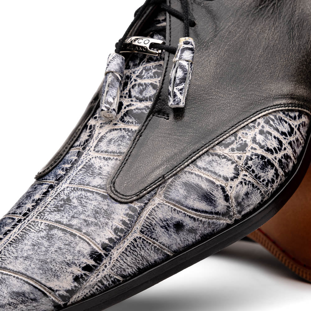 The Anzio Newspaper by Marco Di Milano is a luxury men's shoe with black leather, gray crocodile-pattern texture, brown leather soles, and black laces.