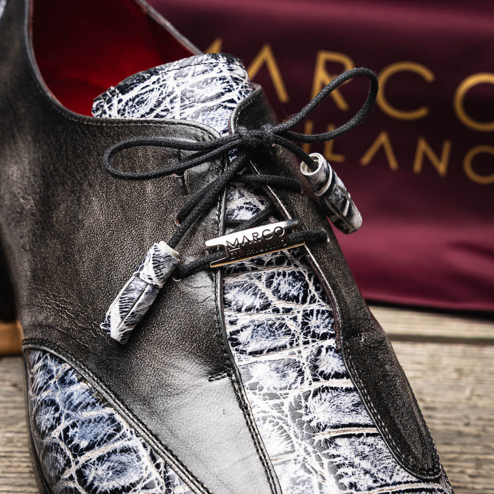 The Anzio Newspaper by Marco Di Milano is a luxury men's shoe with black leather, gray crocodile-pattern texture, brown leather soles, and black laces.