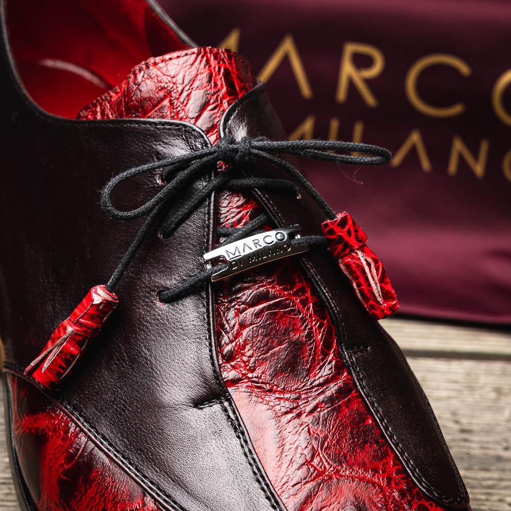The Marco Di Milano Anzio BlackCherry men’s dress shoes feature a red and black textured leather upper, black laces, and tan leather soles—ideal for those seeking luxury footwear.