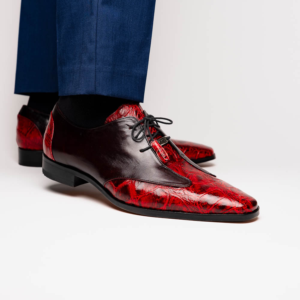 The Marco Di Milano Anzio BlackCherry men’s dress shoes feature a red and black textured leather upper, black laces, and tan leather soles—ideal for those seeking luxury footwear.