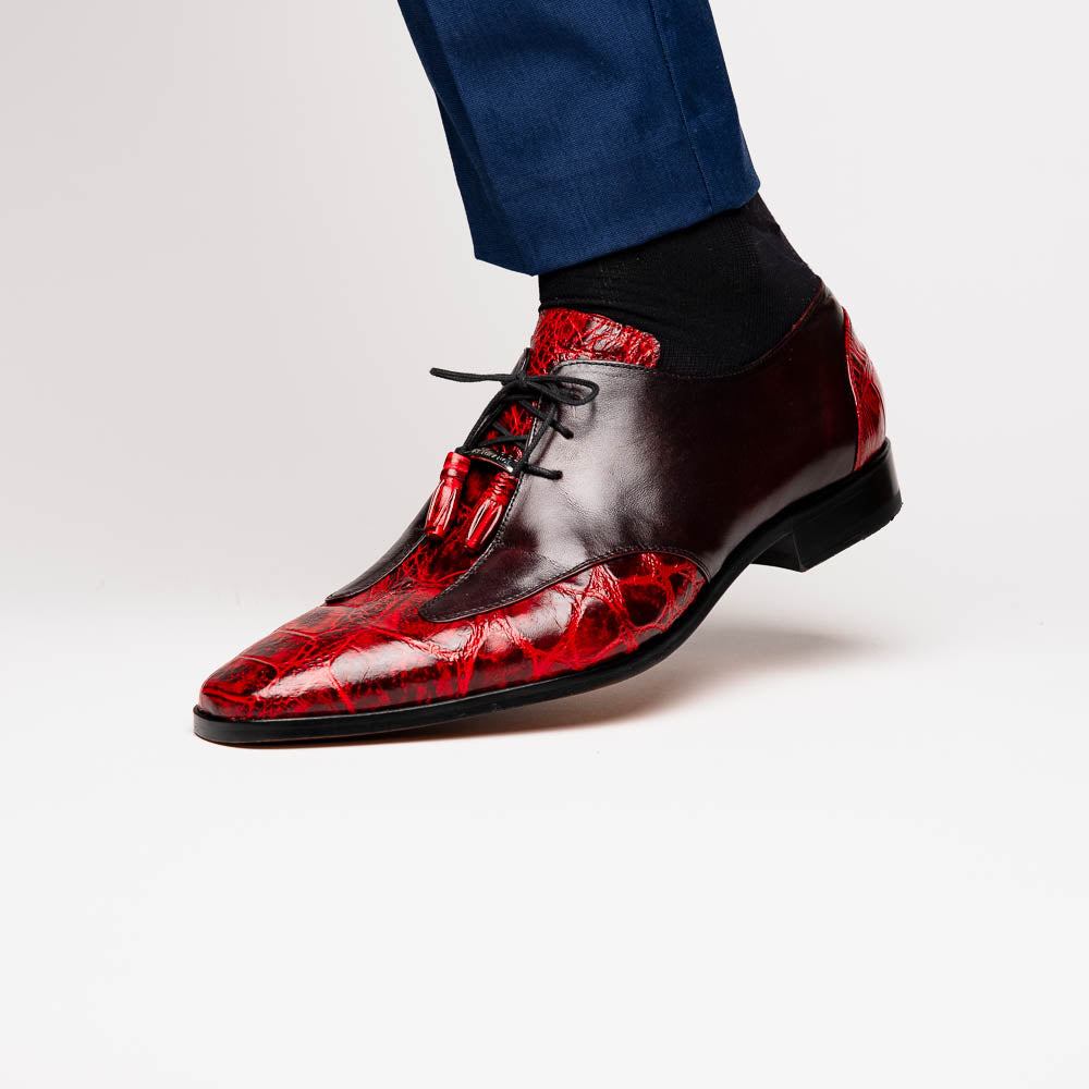 The Marco Di Milano Anzio BlackCherry men’s dress shoes feature a red and black textured leather upper, black laces, and tan leather soles—ideal for those seeking luxury footwear.