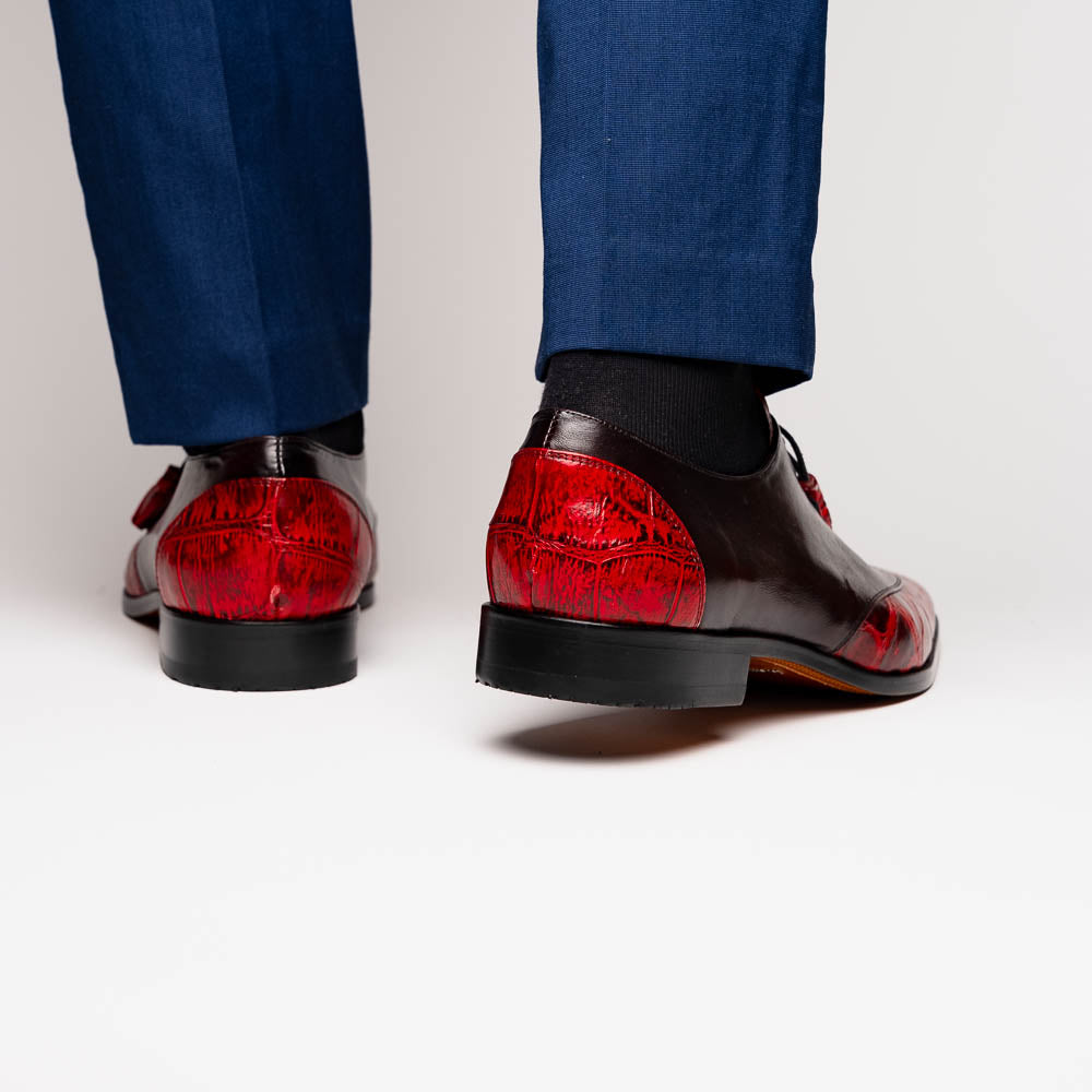 The Marco Di Milano Anzio BlackCherry men’s dress shoes feature a red and black textured leather upper, black laces, and tan leather soles—ideal for those seeking luxury footwear.