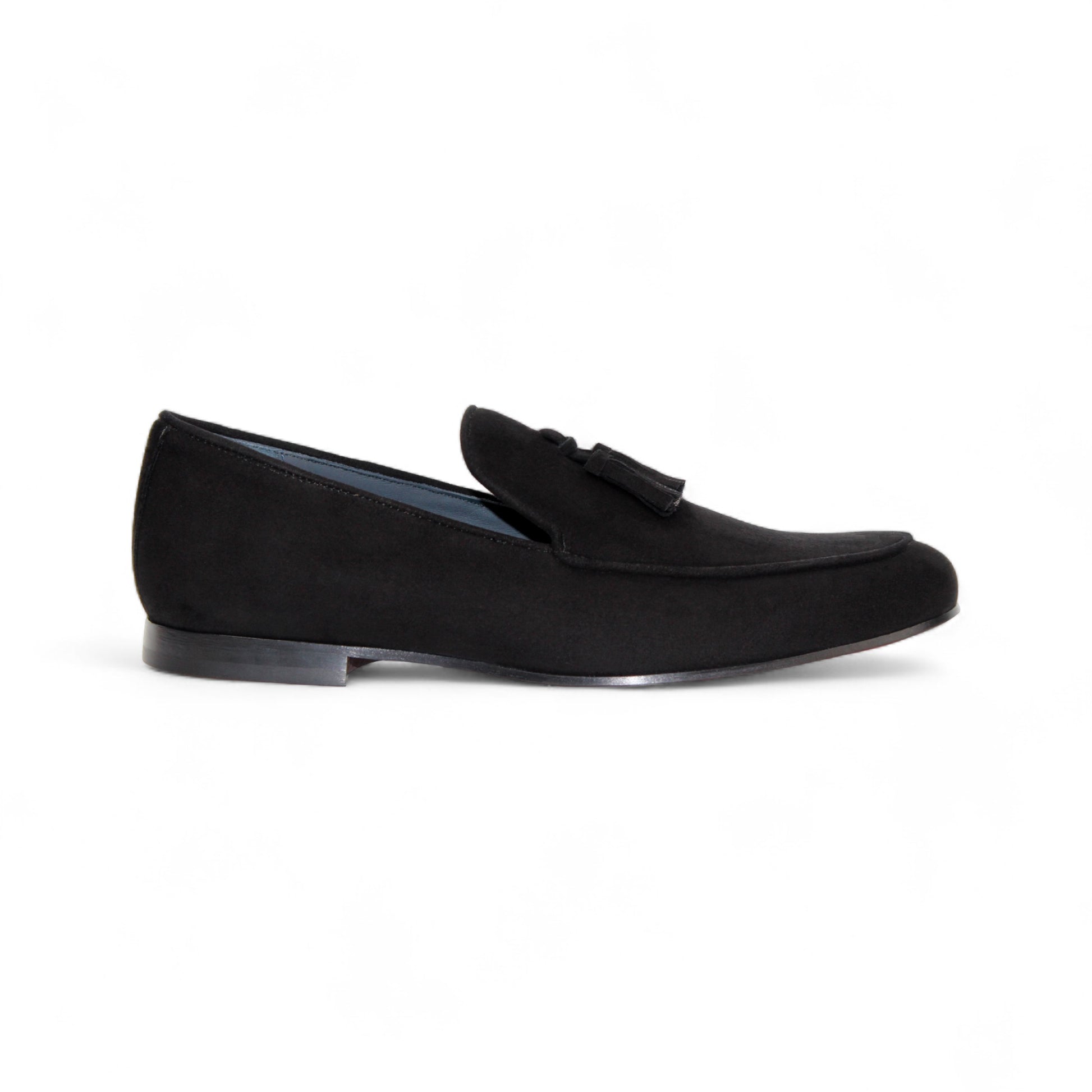 The Duca Di Matiste Duca Anzio Black loafer features premium black suede, a tassel detail, low heel, and rounded toe, shown in a side profile on a white background.