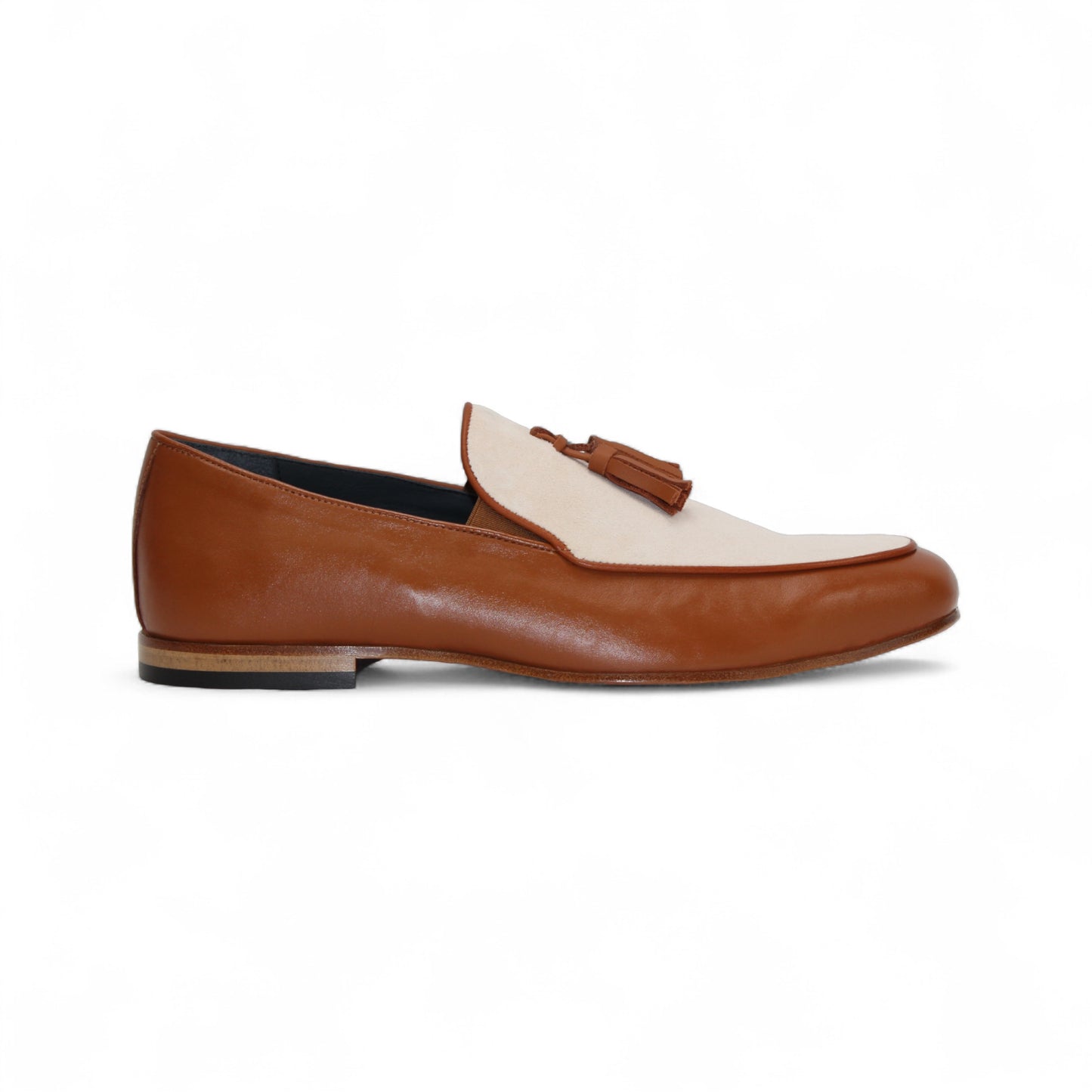 The Duca Di Matiste Duca Anzio Brandy/Bone loafer in brown and beige leather with tassel detail and a suede bottom, shown from the side against a white background.