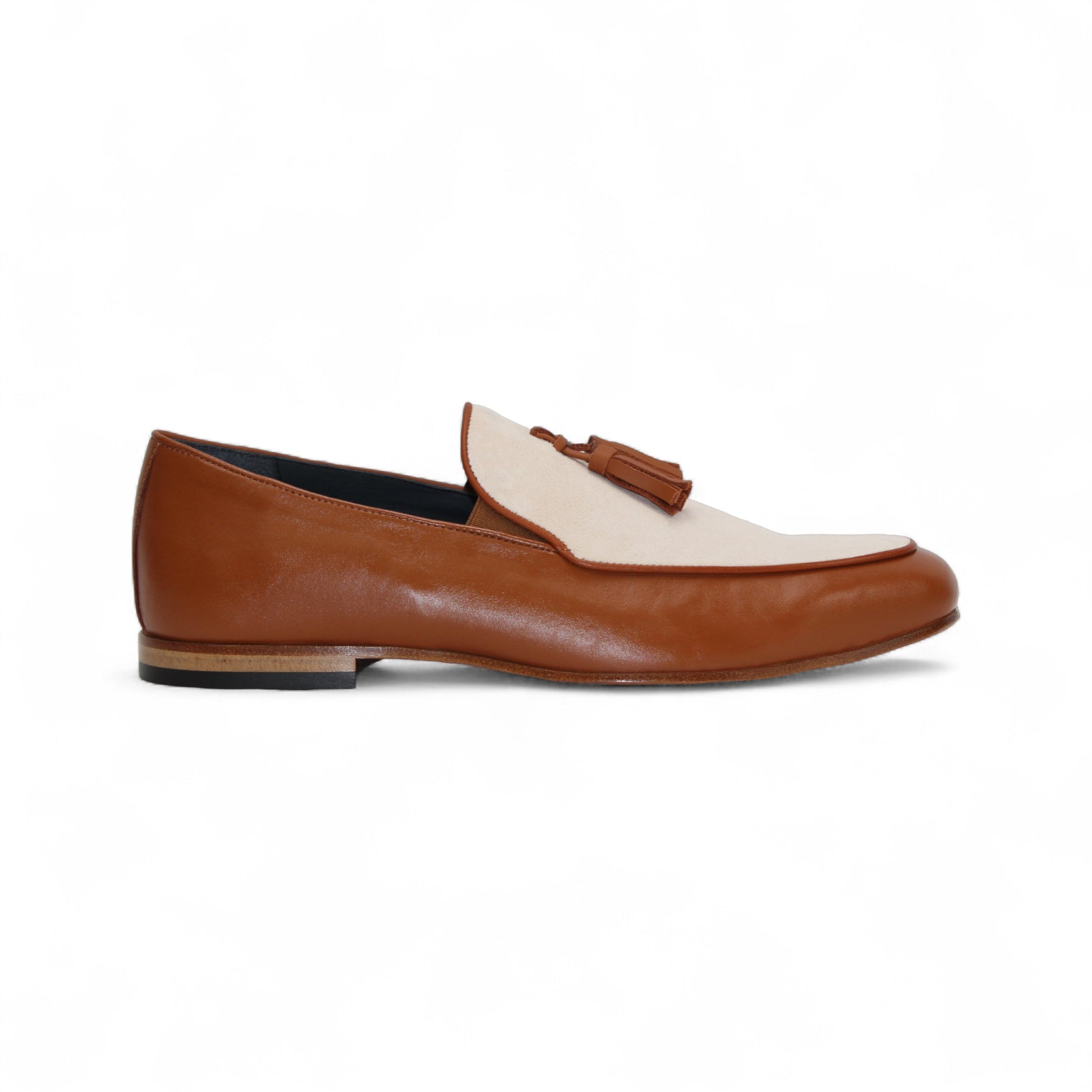 The Duca Di Matiste Duca Anzio Brandy/Bone loafer in brown and beige leather with tassel detail and a suede bottom, shown from the side against a white background.