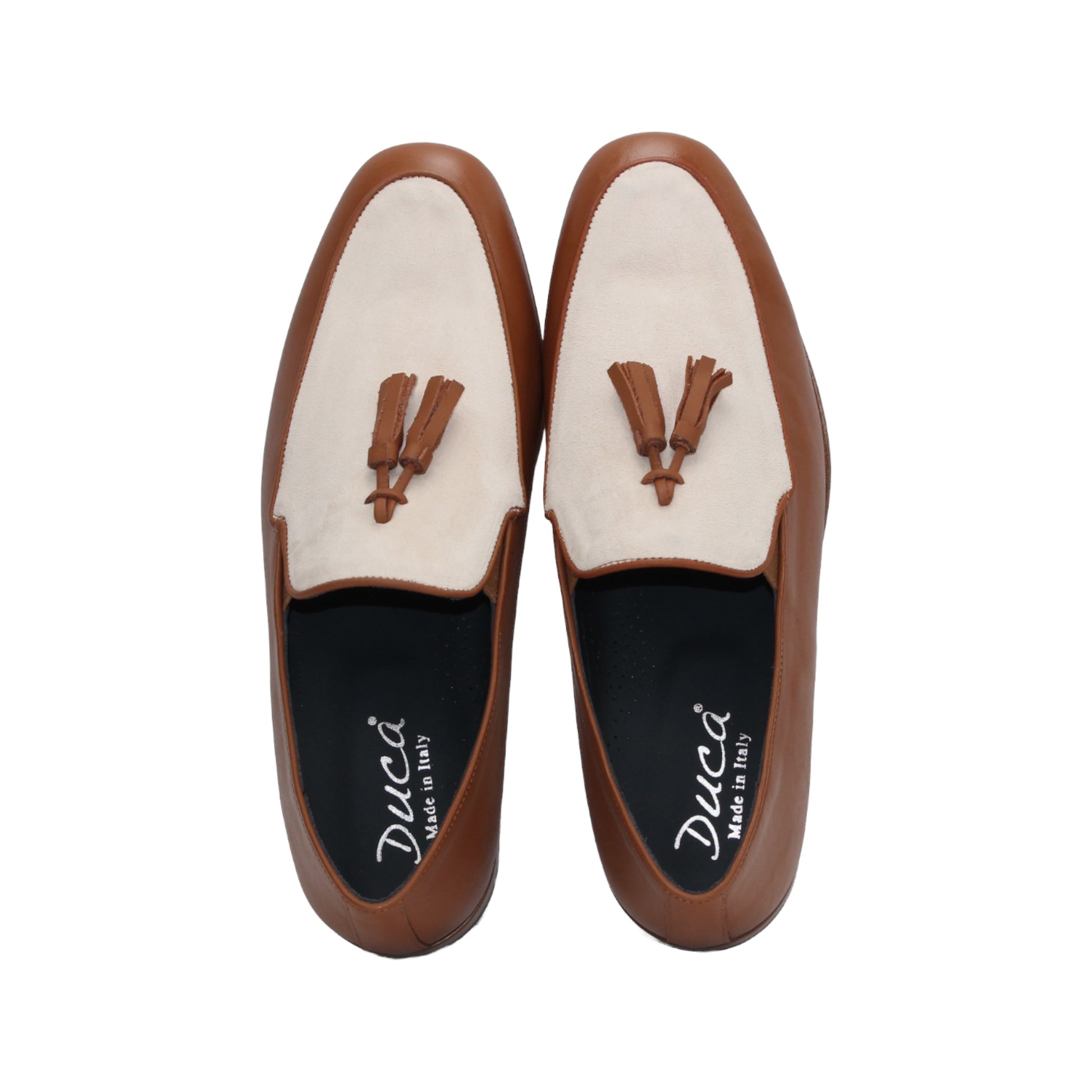 The Duca Di Matiste Duca Anzio Brandy/Bone loafer in brown and beige leather with tassel detail and a suede bottom, shown from the side against a white background.