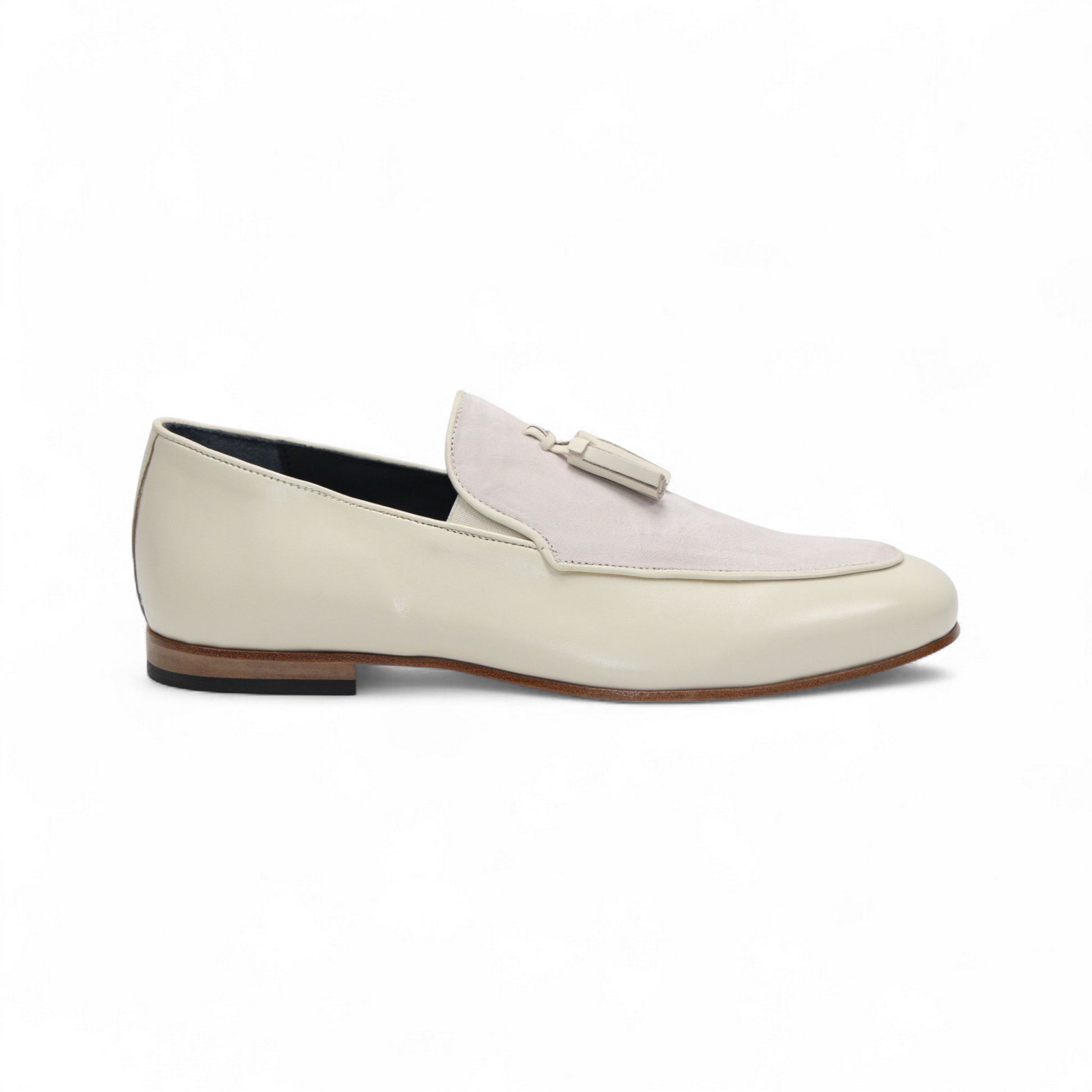 The Duca Anzio Cream by Duca Di Matiste is a men's loafer featuring cream and light beige tones, tassel detail, low wooden heel, and a smooth leather finish for refined minimalist style in a sleek side profile.