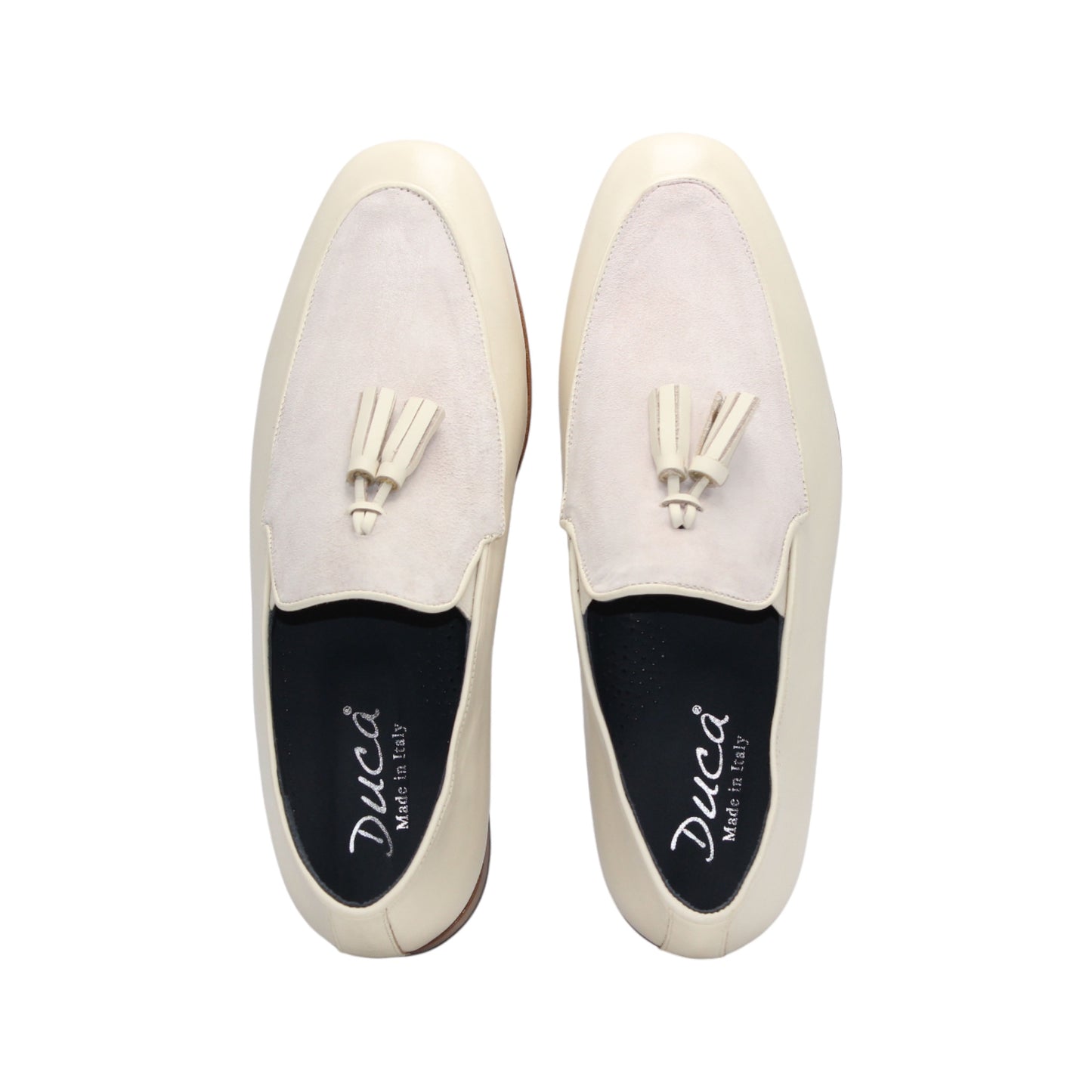 The Duca Anzio Cream by Duca Di Matiste is a men's loafer featuring cream and light beige tones, tassel detail, low wooden heel, and a smooth leather finish for refined minimalist style in a sleek side profile.