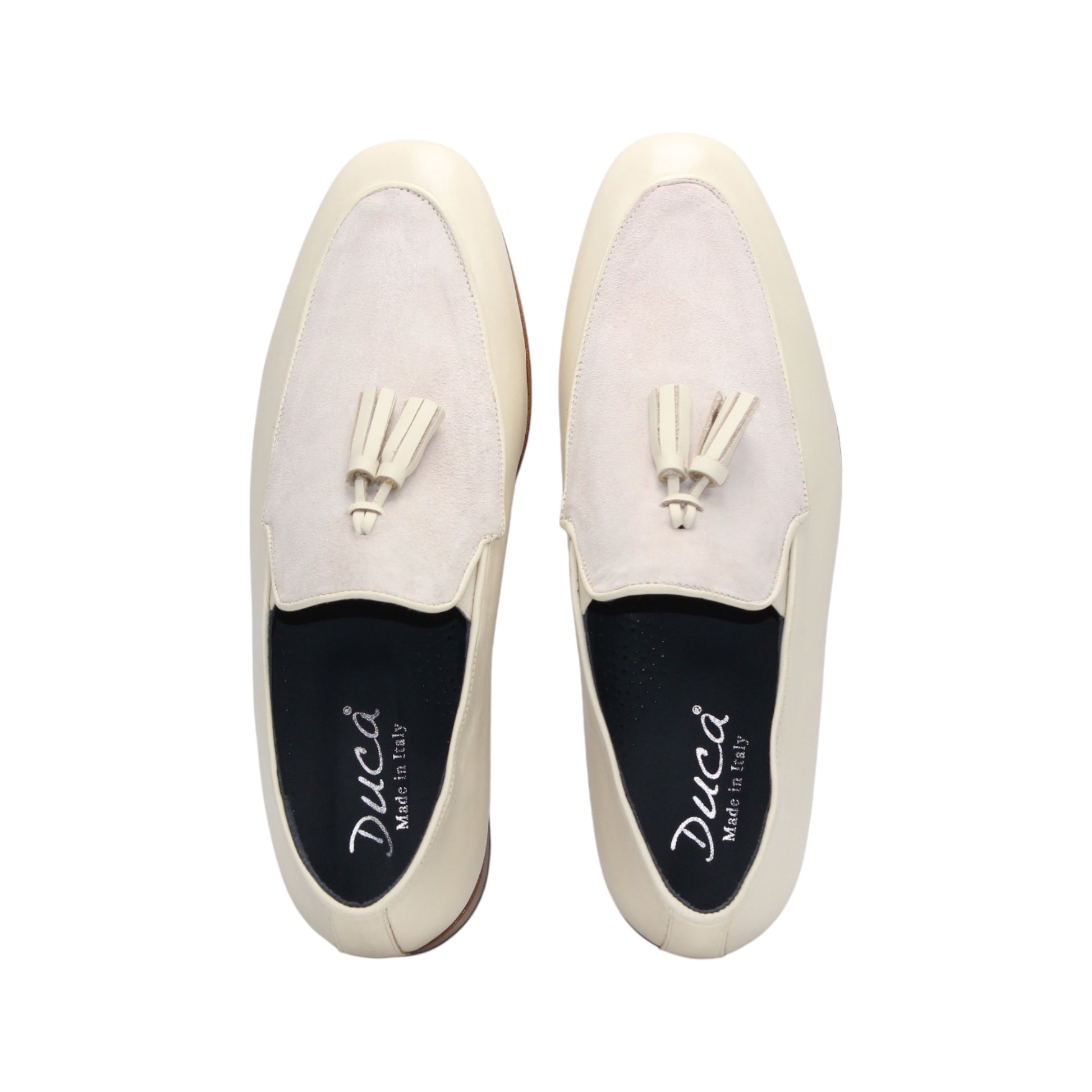 The Duca Anzio Cream by Duca Di Matiste is a men's loafer featuring cream and light beige tones, tassel detail, low wooden heel, and a smooth leather finish for refined minimalist style in a sleek side profile.