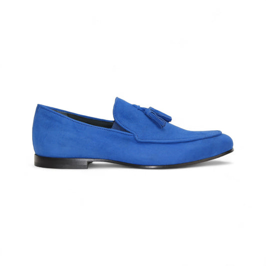 The Duca Di Matiste Duca Anzio Saphire is a blue suede loafer with tassel detailing and a leather sole, made in Italy, shown from the side against a white background.