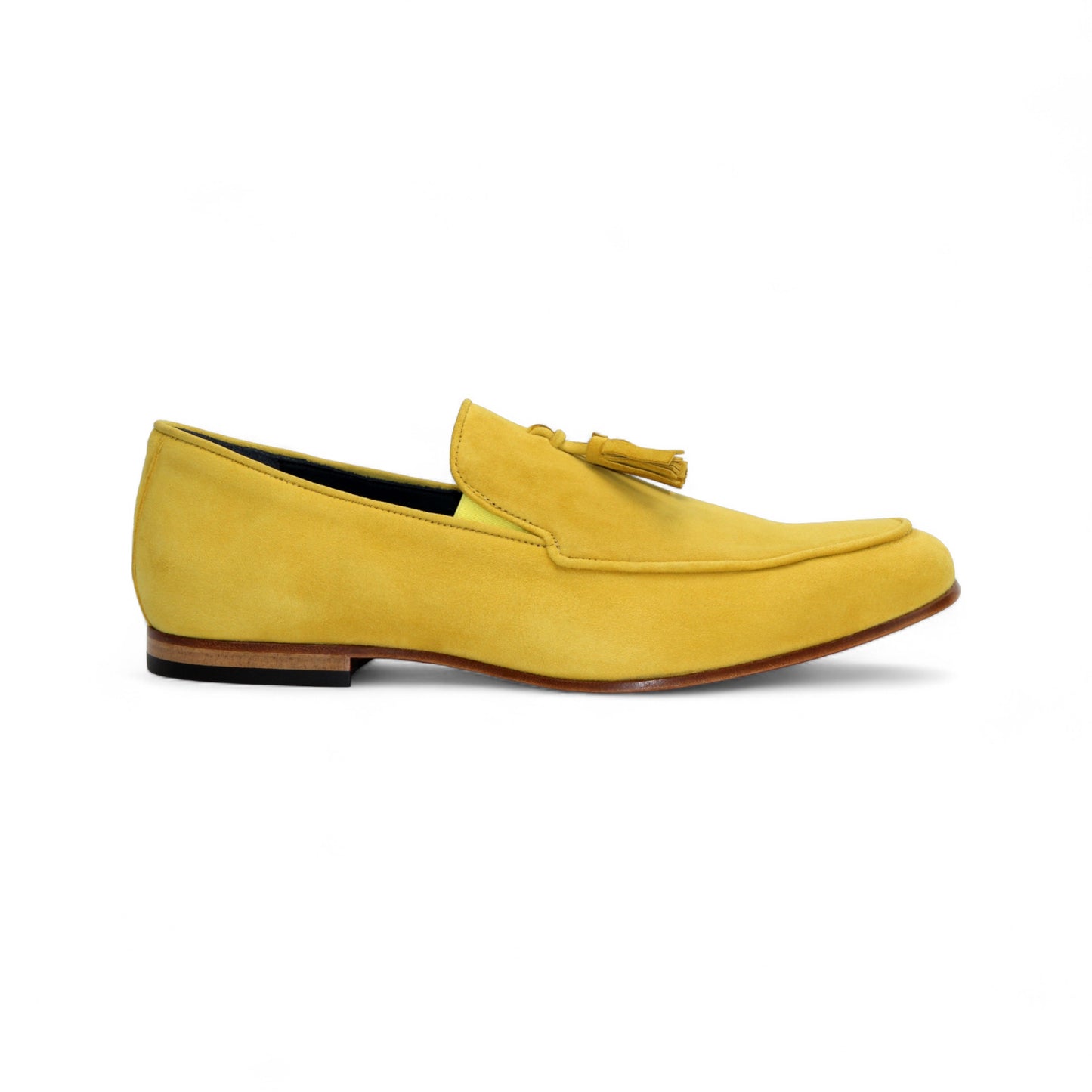 The Duca Di Matiste Duca Anzio Yellow is a single yellow suede loafer made in Italy, featuring a tassel detail, low wooden heel, and stitched trim, shown in profile against a white background.