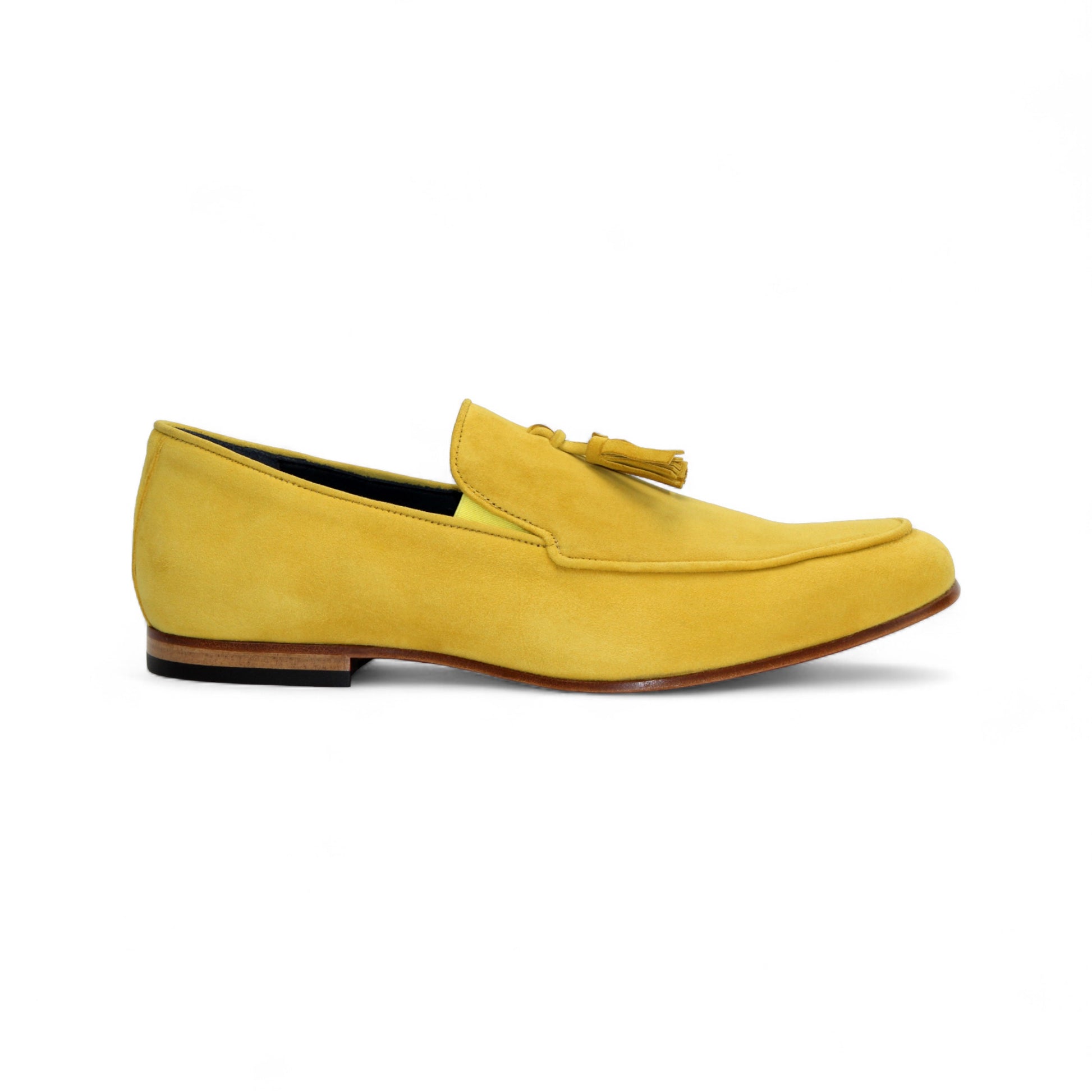 The Duca Di Matiste Duca Anzio Yellow is a single yellow suede loafer made in Italy, featuring a tassel detail, low wooden heel, and stitched trim, shown in profile against a white background.