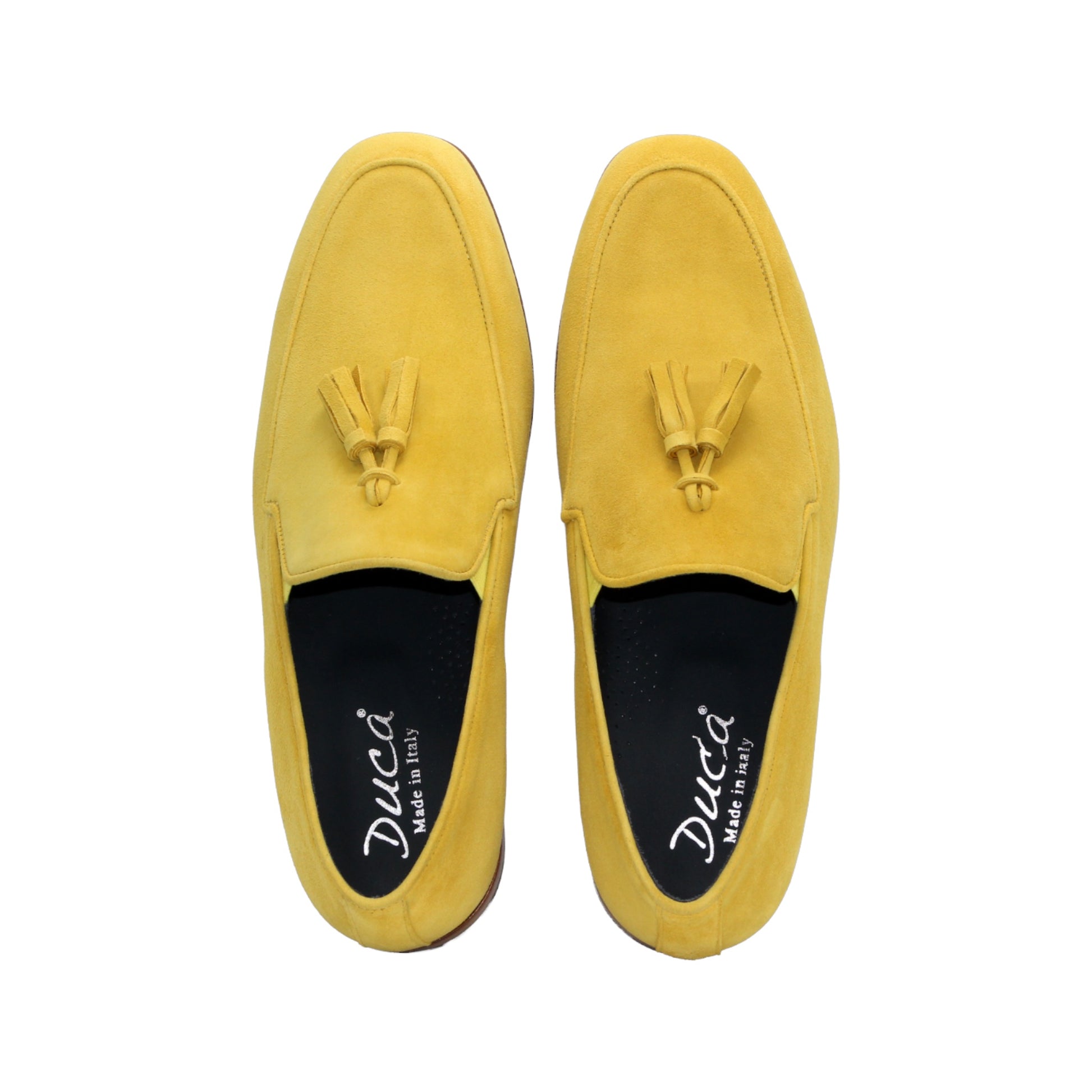 The Duca Di Matiste Duca Anzio Yellow is a single yellow suede loafer made in Italy, featuring a tassel detail, low wooden heel, and stitched trim, shown in profile against a white background.